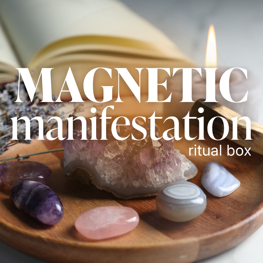 Magnetic Manifestation Ritual Box by Saged with candles, crystals, and tools for manifestation rituals.